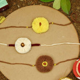 Sun, Moon and Dhavala Seed Rakhi Gift Hamper With Kaju Katli Mini Bites 125 gm